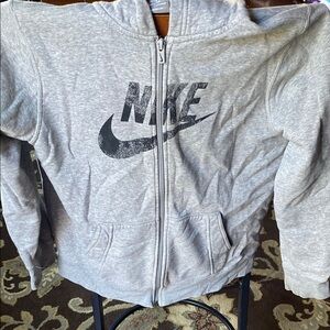 Nike size L(14/16) hoodie approximately 24 inches long. Nice condition.
